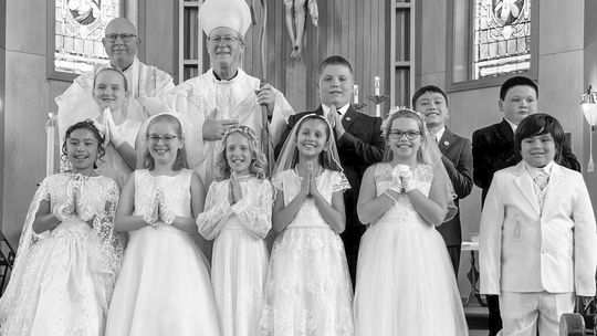 Third graders from Lake Leelanau St. Mary made their first communion and reconciliation Sunday