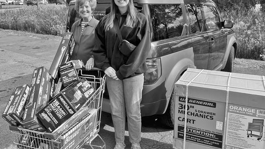 Riley Brown, a recent Glen Lake graduate, purchased $2,000 of mechanics tools with a scholarship from the Glen Lake Woman’s Club. She is pictured here with scholarship committee member Ginna Woessner. Courtesy photo