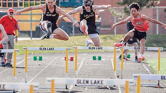 Glen Lake, Leland, and Benzie Central 300-meter hurdlers compete during the first track meet of the season. From left to right Caden Sheehan, Jimmy Alpi and Joseph Abeyta. Photo courtesy of Bob Alpi