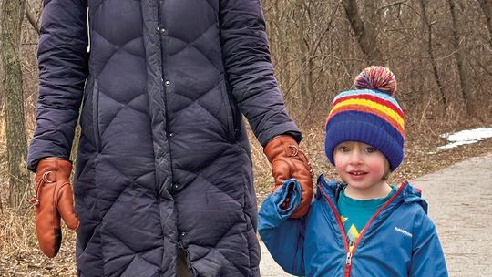 Tracy Smedes-Hepler and her friend, Luca, 3, enjoyed some fresh air and exercise Tuesday, walking on the Leelanau Trail in Suttons Bay. Enterprise photo by Amy Hubbell