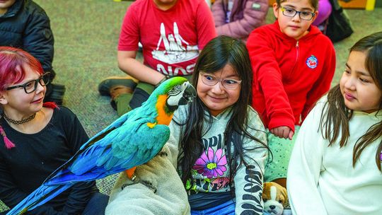 Tyler’s Exotics, a Mobile Petting Zoo, visited Suttons Bay Elementary School last week. Students learned about and had close encounters with a boa constrictor, monkey, tortoise, bearded dragon, tarantula, and macaw. Photo courtesy of Shelagh Fehrenbach