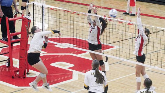 Glen Lake senior Peyton Brown spike the ball against Suttons Bay during the Norse last home game of the season.
