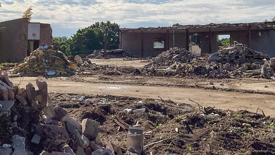 The exterior demolition of the former Leelanau Memorial Hospital, pictured here on Tuesday morning, is progressing and currently underway. Photo courtesy of Allan Dalzell