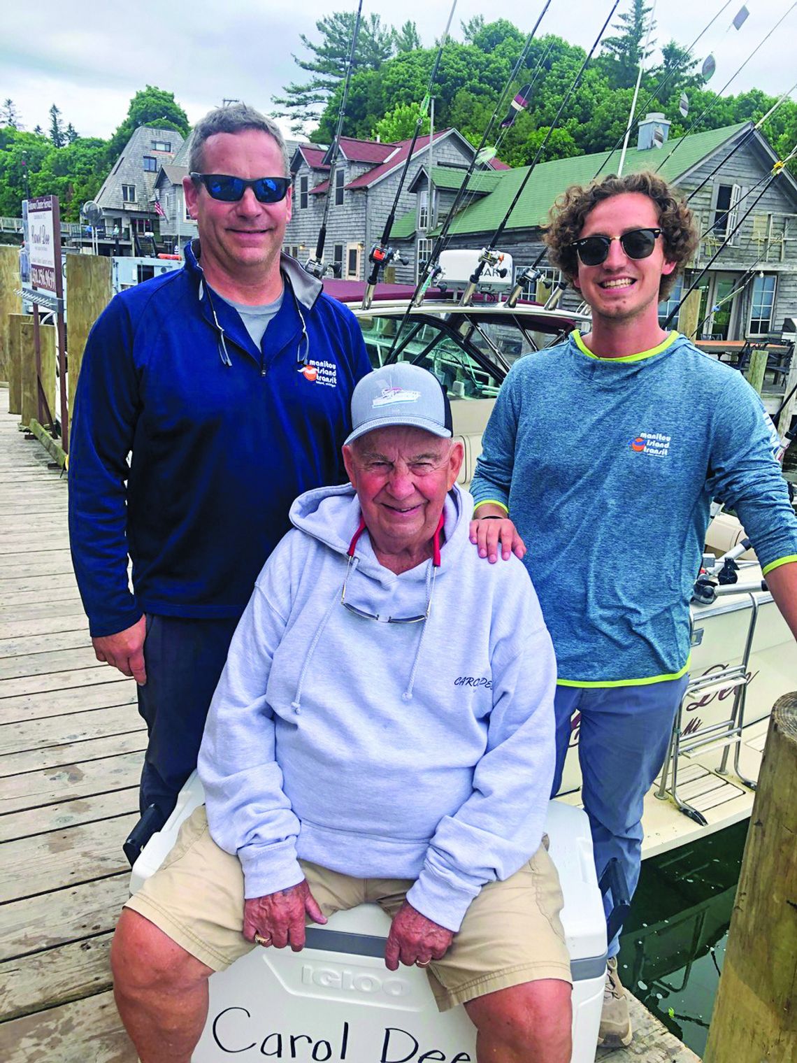 Jim Munoz, who has been charting clients out of Fishtown for 52 years, is flanked by his son, Jimmy, and grandson, Jack. Enterprise photo by Alan Campbell
