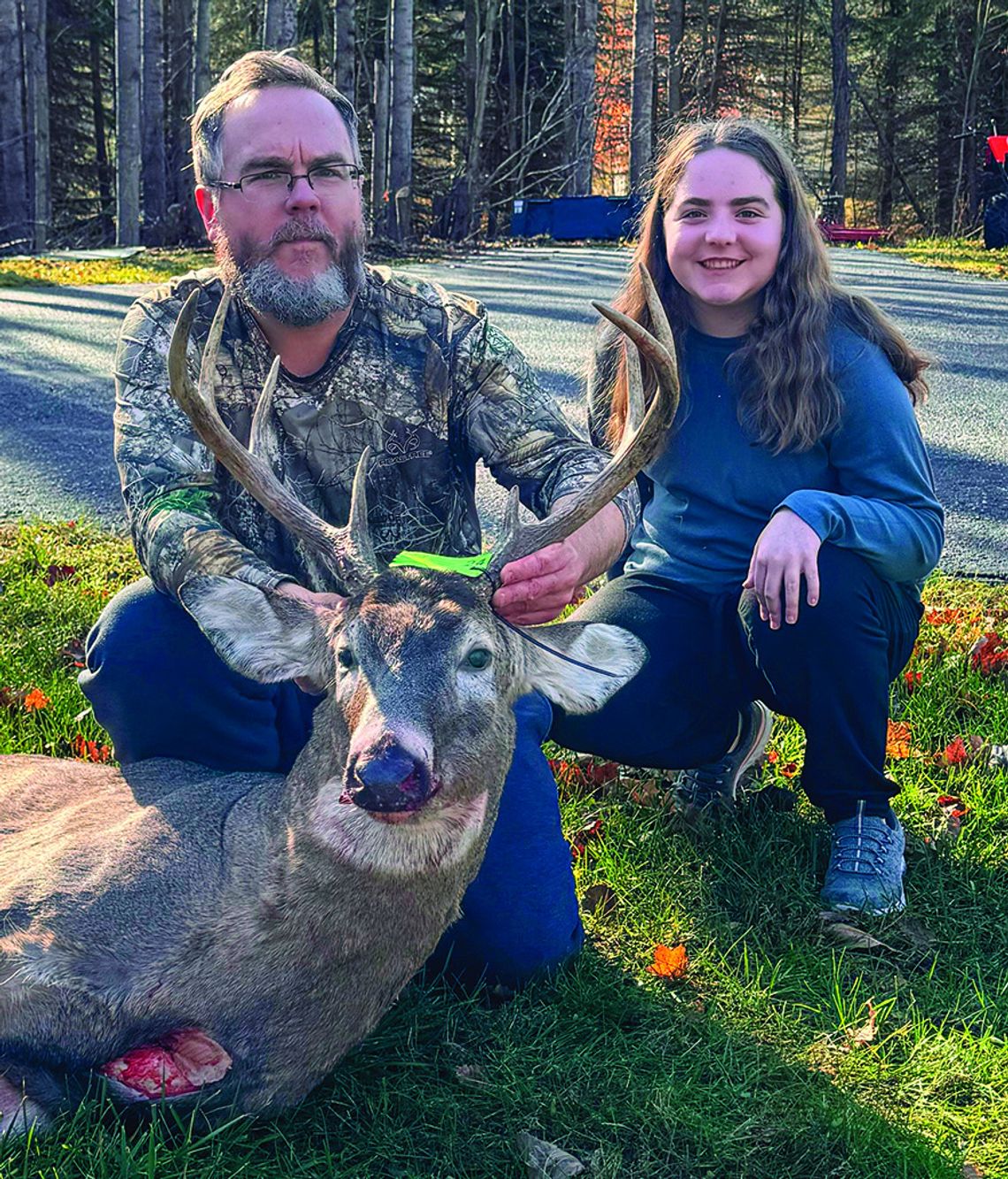 Jeremy Tobin, who shot two big bucks six days apart, occasionally hunts with his 14-year-old daughter Grace. His wife, Rebecca, helped track his first harvest, which had a tall rack. Courtesy photo