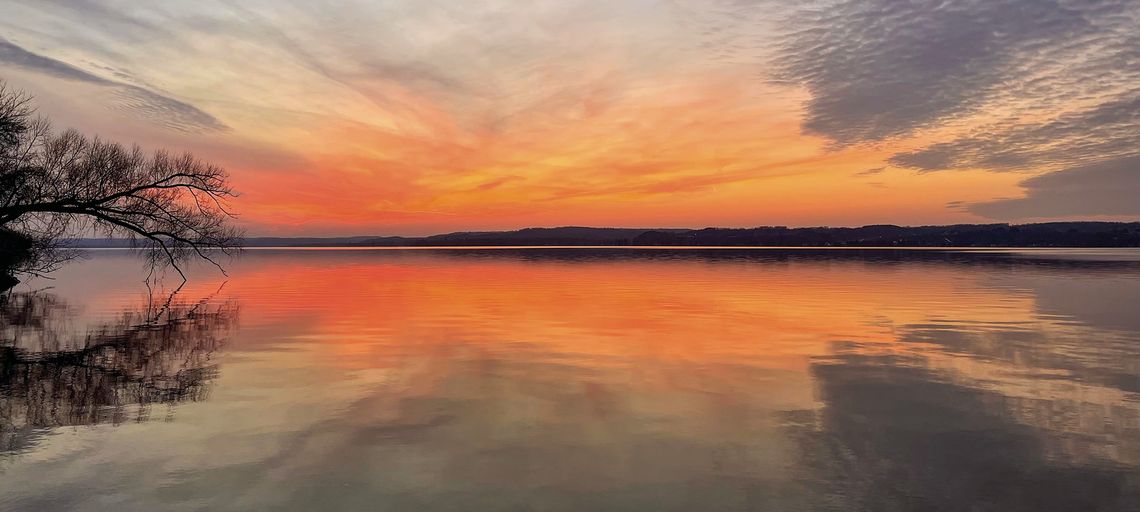 A warm colored sunset over Lake Leelanau A warm colored sunset over Lake Leelanau is seen at Bingham Boat Launch on the evening of the winter solstice last Thursday. The celebration of the winter solstice marks the shortest day of the year and the longest night in the hemisphere. Enterprise photo by Meakalia Previch-Liu