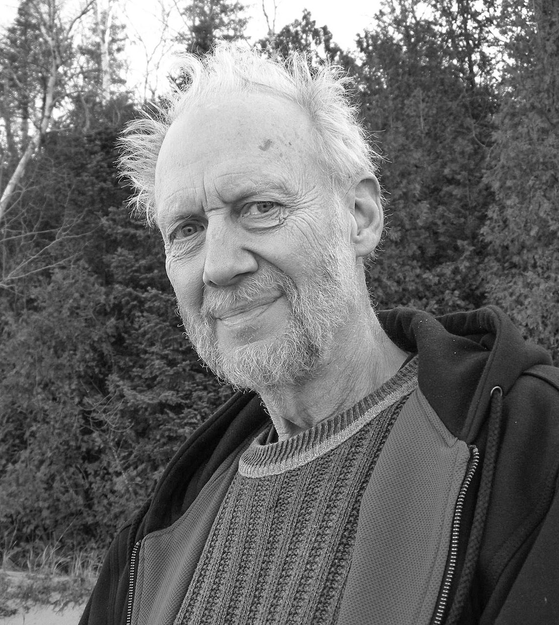 Porter Abbott, a research professor emeritus at the University of California, Santa Barbara, sits on the beach near the waters of Lake Michigan. Abbott moved to Leelanau County full time after teaching at the university’s English department for many years, fulfilling his lifelong goal of r...