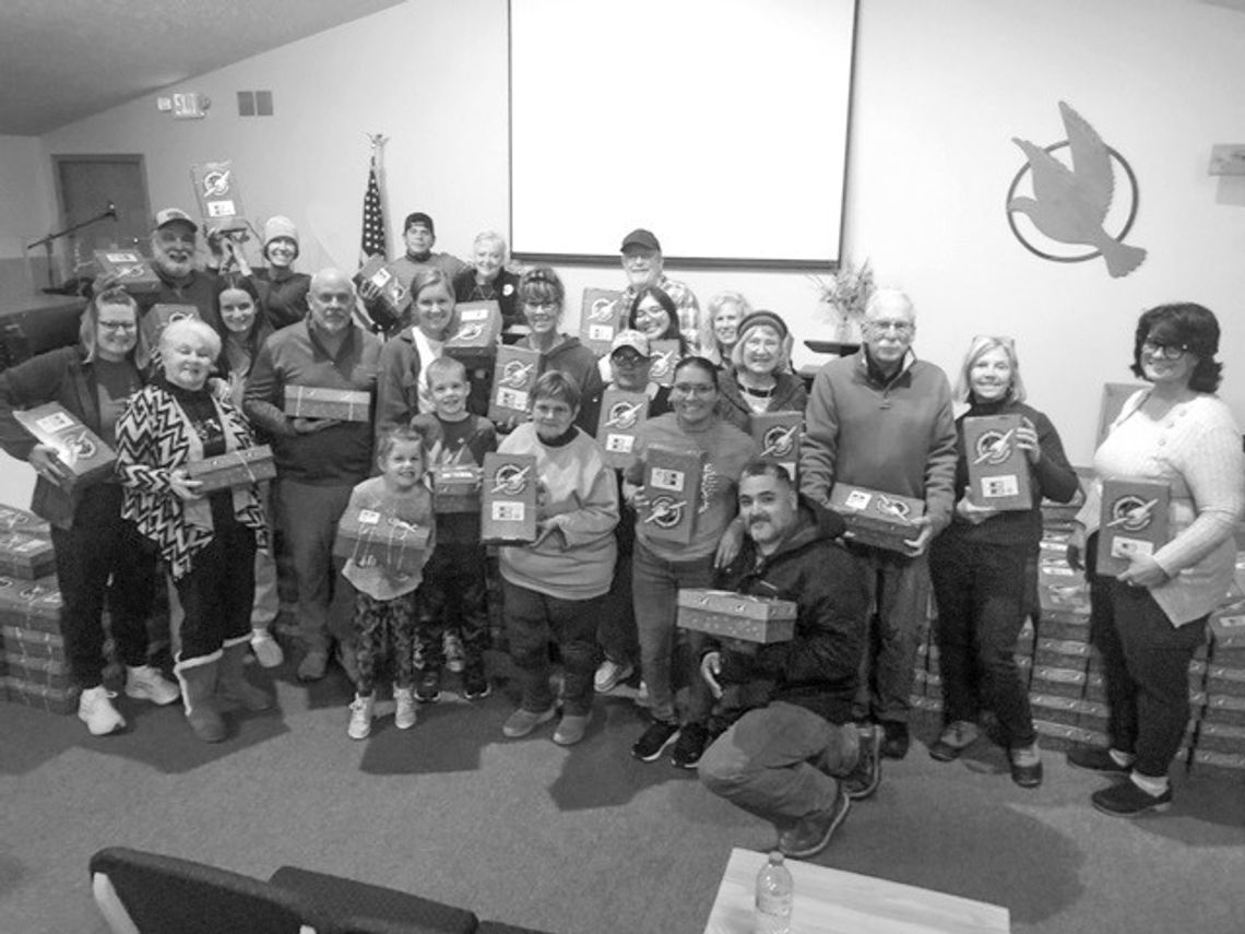Above, members of the Leelanau Community Church assembled 300 Operation Christmas Child boxes Tuesday night Above, members of the Leelanau Community Church assembled 300 Operation Christmas Child boxes Tuesday night