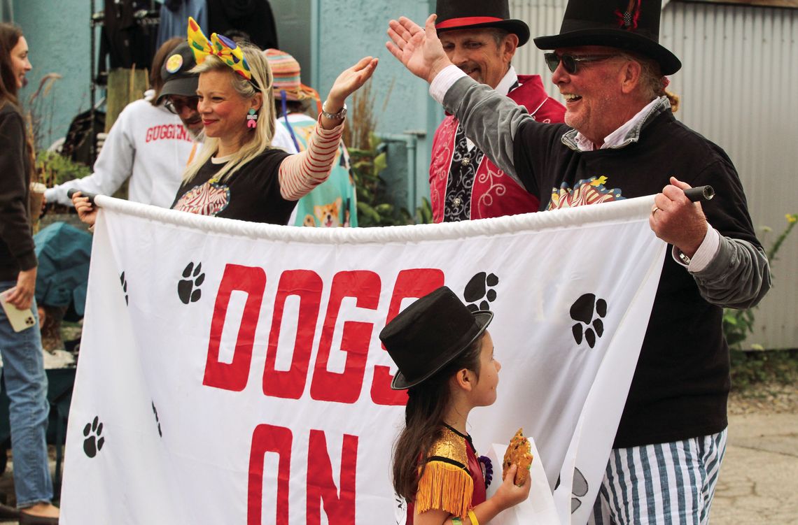 Actress Amy Smart and chef and author Mario Batali, from left, led the Northport Dog Parade. See story and more coverage on Pg. 11, Section 2. Enterprise photo by Brian Frieberger.