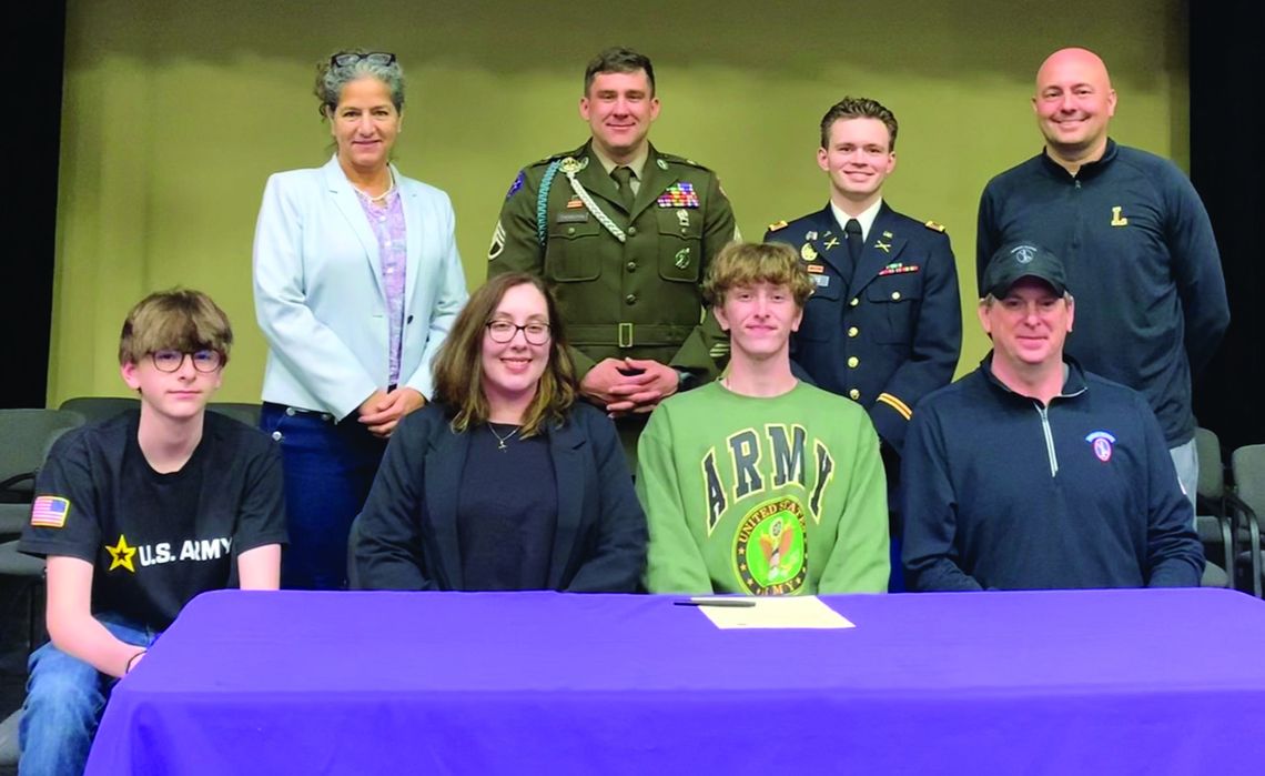 Jimmy Alpi signs to the Army with his dad, mother, and brother look on. Local Army Sergeant Michael Thorton and his captain were in attendance. Courtesy photo