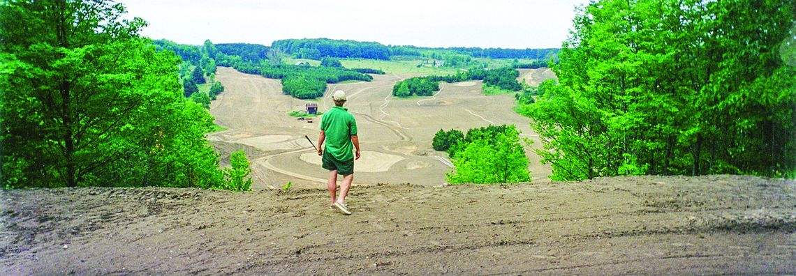 Bahle Farms is celebrating their 25th anniversary this month. Somewhere around 1998, a man imagines swinging his drive from a dirt hill that is now Bahle Farms. Courtesy photo