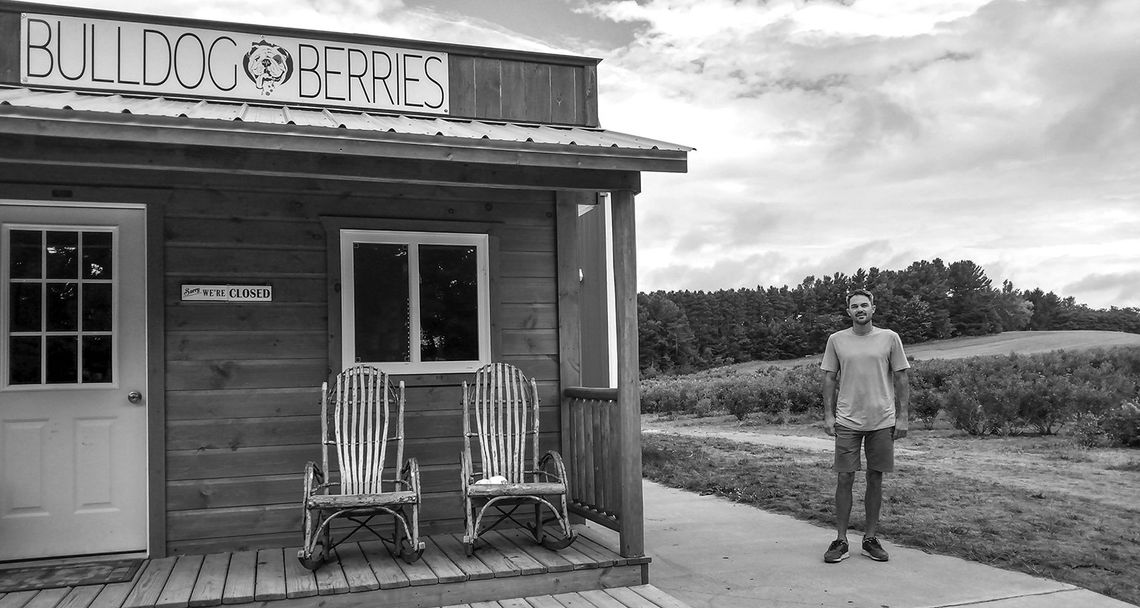 Nick Billings stands near the storefront at his blueberry farm, Bulldog Berries. Billings started with five acres of farm in 2012, and today, he has 25 acres of blueberries in 12 different varieties. Enterprise photo by Zachary Marano