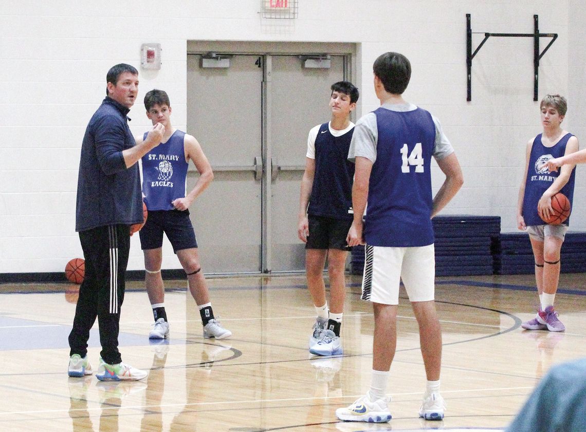 Lake Leelanau St. Mary coach Jim Bunek teaches a ball handling drill at practice earlier this week. Enterprise photo by Brian Freiberger