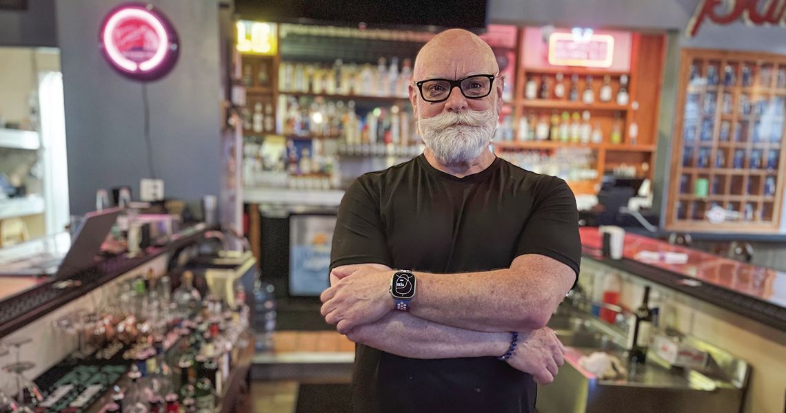 Scott North of Streetside Grille in Suttons Bay has been serving up drinks and smile for the past decade. Enterprise photo by Brian Freiberger