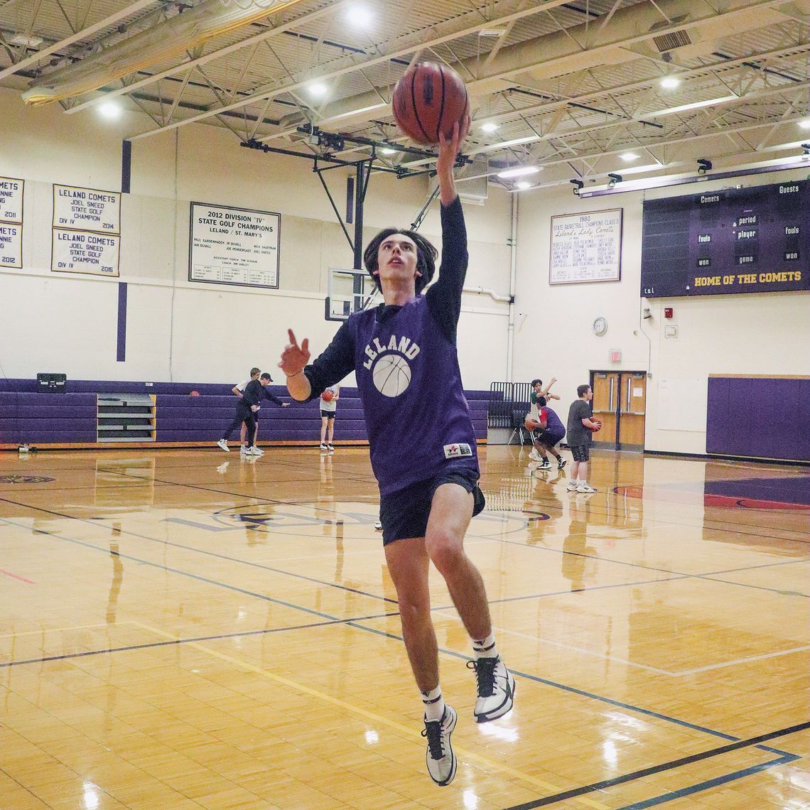 Leland junior Ravello Smith practice driving to the hoop Monday befor the regular season basketball schedule starts Wednesday, Dec. 4 at 7 p.m. against Grand Traverse Academy. Enterprise photo by Brian Freiberger