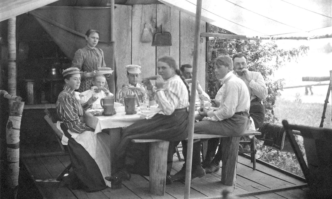 It took a while for sweet corn to become an American summer standard. This picture is of a family enjoying corn during a visit to North Lake Leelanau. Photo courtesy of the Leelanau Historical Society