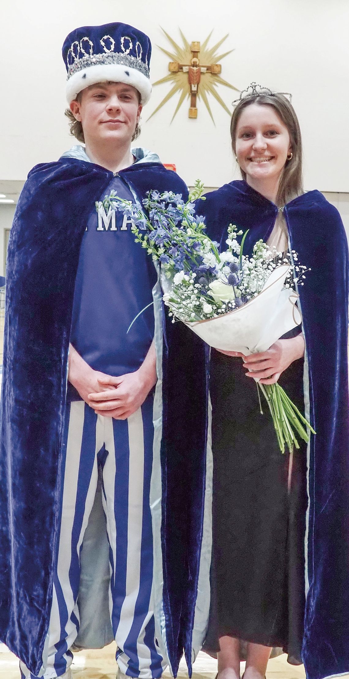 Correction: Lake Leelanau St. Mary senior Eli Kelenske (left) Sarah Bunek (right) became royalty during the boys basketball game against TC Christian earlier this month they were named winter homecoming kind and queen. Courtesy photo