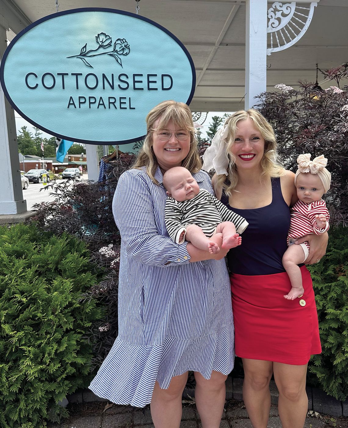 Cottonseed Apparel owners Lizzie Gray (left) and her son, Rory, and Laurenn Rudd (right) with her daughter, Quinn Ankerson, are pictured at the store in Glen Arbor last week. The two business partners became pregnant around the same time and have been bringing their babies into work since...