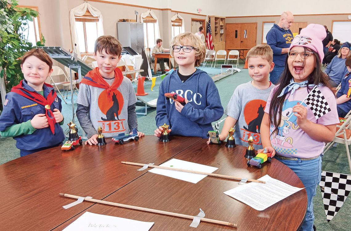 The Wolf Den Cub Scouts display colorful cars they created and the trophies they received at the Pack 131 Pinewood Derby. From left to right: Phillip Bradford, Declan Draper, Logan Hutcheon, Zac Richter and Nokami Kwe Winchester. Photos courtesy of Lynn Bakker