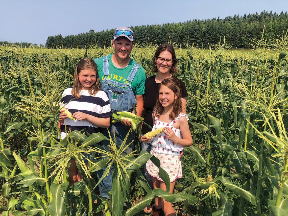 Curtis and Melissa Kelenske Curtis and Melissa Kelenske get help from their daughters, Sasha, 11, and Sienna, 7, picking sweet corn from their family farm in Centerville Township. See story Pg. 8 Enterprise photo by Alan Campbell