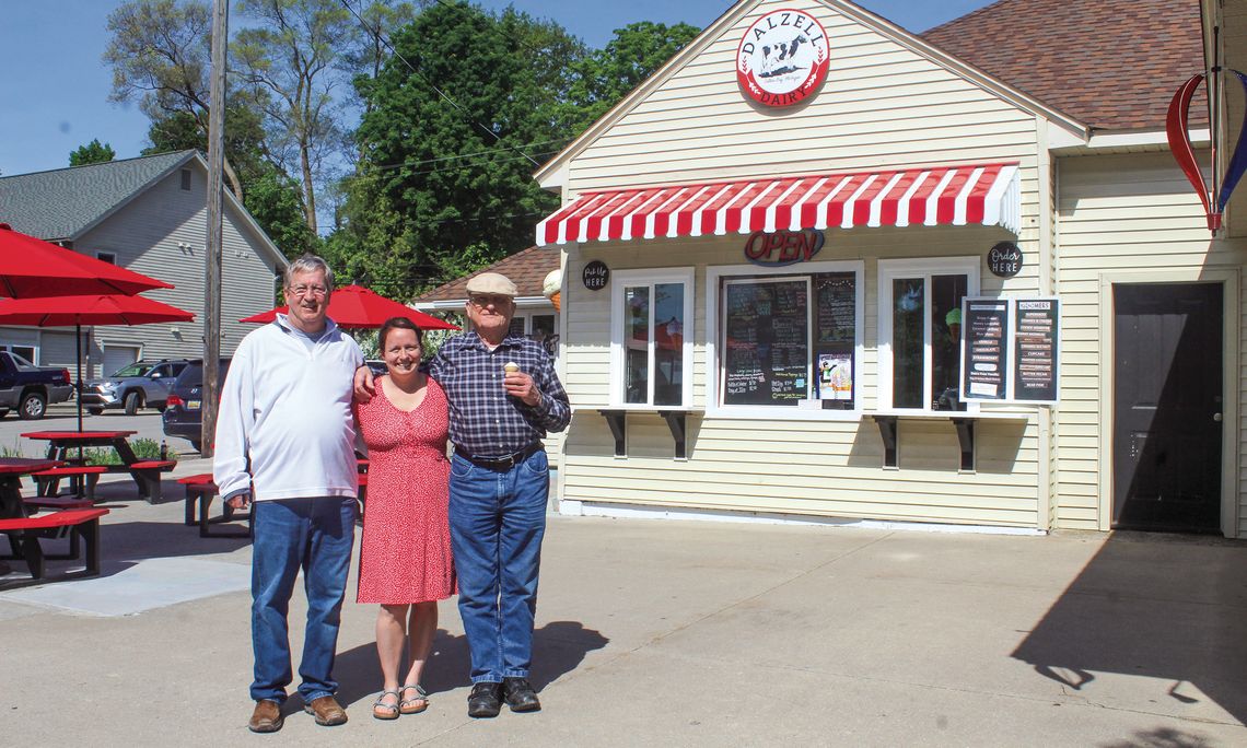 From left to right: Doug Dalzell, Haley Fox, and Alan Dalzell stand in front of the family business. Enterprise photo by Brian Freiberger