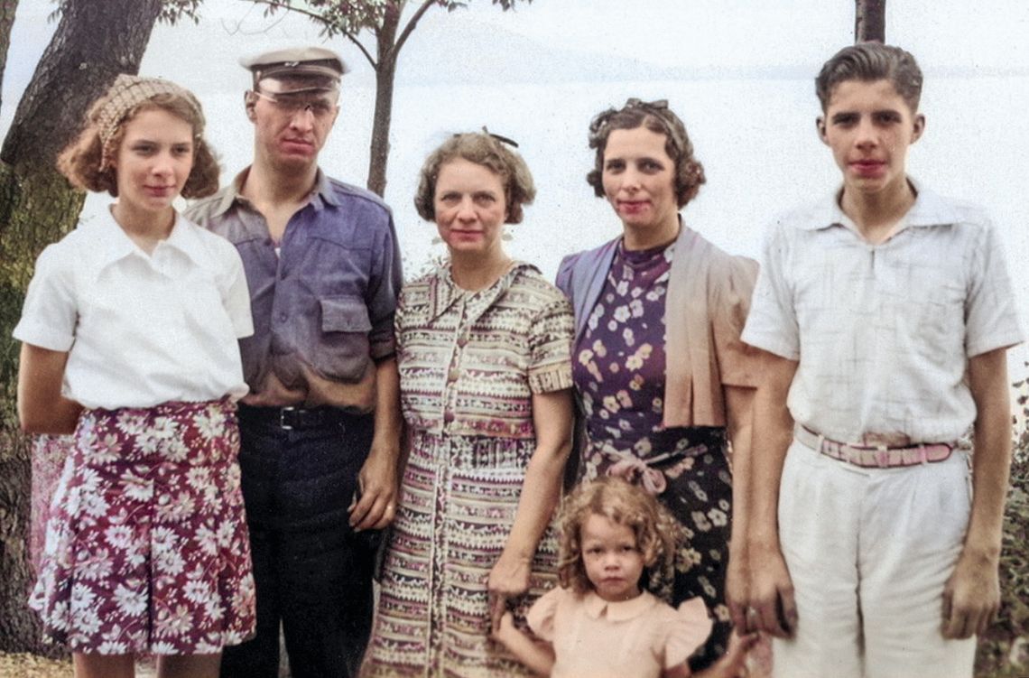 Some members from two generations of the DeKorne family stand together for a family photo at Inspiration Point on Glen Lake. Second from the left is Casey DeKorne, who worked alongside his brother Lewis to develop their father Boudewijn’s wood carving business into DeKorne Furniture Compan...