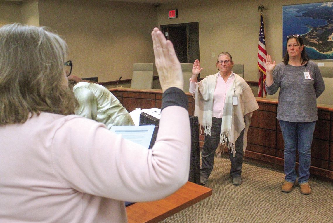 Deputy Lyn Drzewiecki and Deputy Alison Middleton Deputy Lyn Drzewiecki (left) and Deputy Alison Middleton (right) sworn in during the presidential primary election on Tuesday. Drzewiecki and Middleton are trained election workers and served as the Receiving Board for Early Voting. Enterprise photo by Brian Freiberger