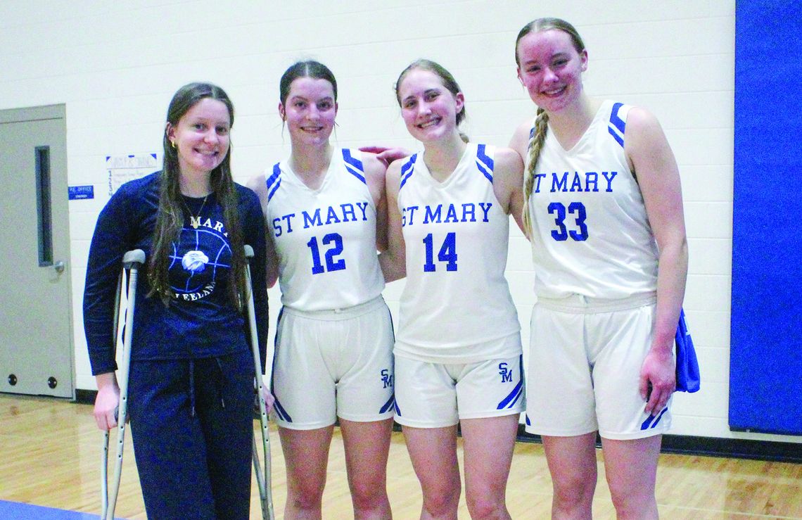 Lake Leelanau St. Mary girls basketball seniors from left to right: Sarah Bunek, Della Bunek, Delana Kirt, and Leah Fleis. Enterprise photo by Brian Freiberger