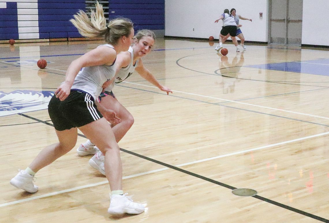 St. Mary senior Cathryn Mikowski and Kyla Barnowski battle for possession during a practice drill last week. Enterprise photo by Brian Freiberger