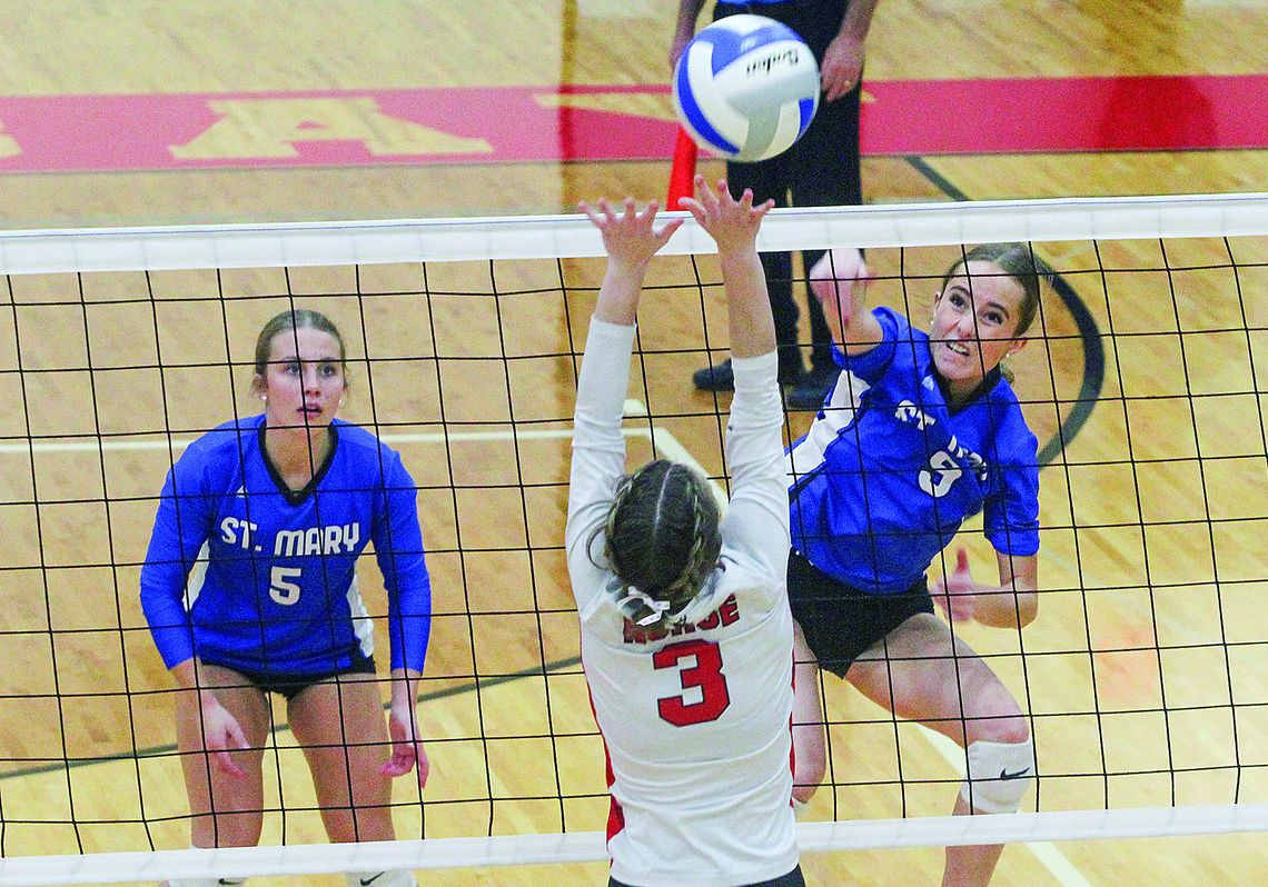 Lake Leelanau St. Mary junior Maggie Ursu spikes the ball against Suttons Bay Wednesday during a district semifinal game. Enterprise photo by Brian Freiberger