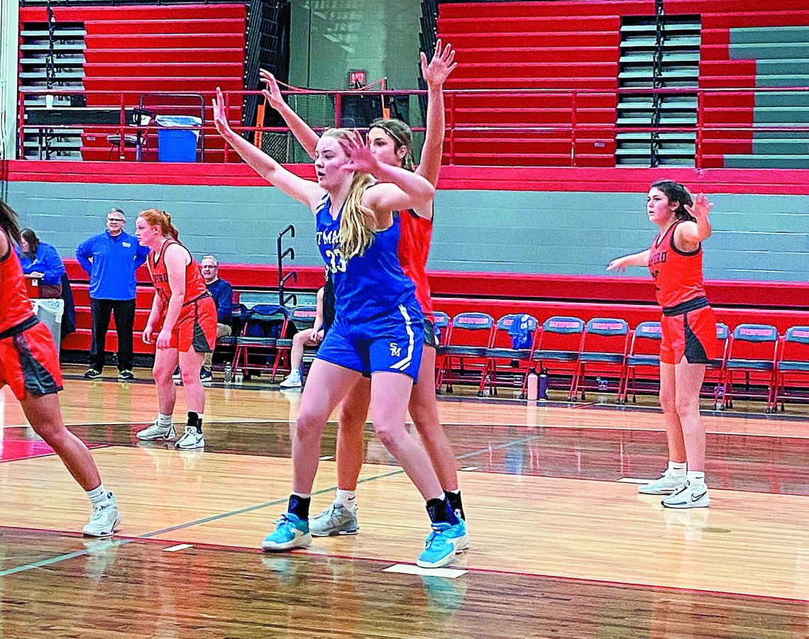 Lake Leelanau senior Leah Fleis posts up a Bedford defender during a downstate trip this weekend. Courtesy photo