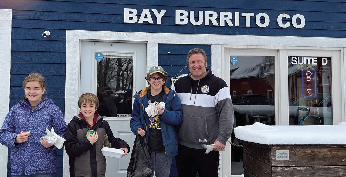The Fillipp family from Vila Park, Illinois waits patiently to be the first customers of Bay Burrito in 2024. From left to right: Violet, Luke, Ben and Andy Fillipp. Courtesy photo