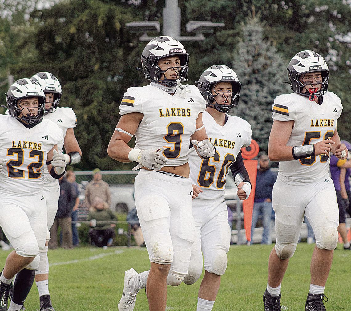 Several Glen Lake football players run off the field against Frankfort earlier this season. Glen Lake won its third straight game of the season in a 46-0 route of Harbor Springs. Photo courtesy of Meredith McNabb