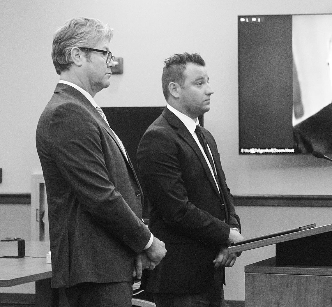 Elijah George (right) hears the sentencing handed to him on two charges including use of a computer to commit a crime (a 4-year felony) and surveying an unclothed person (a 0-11 month felony). Enterprise photo by Brian Freiberger