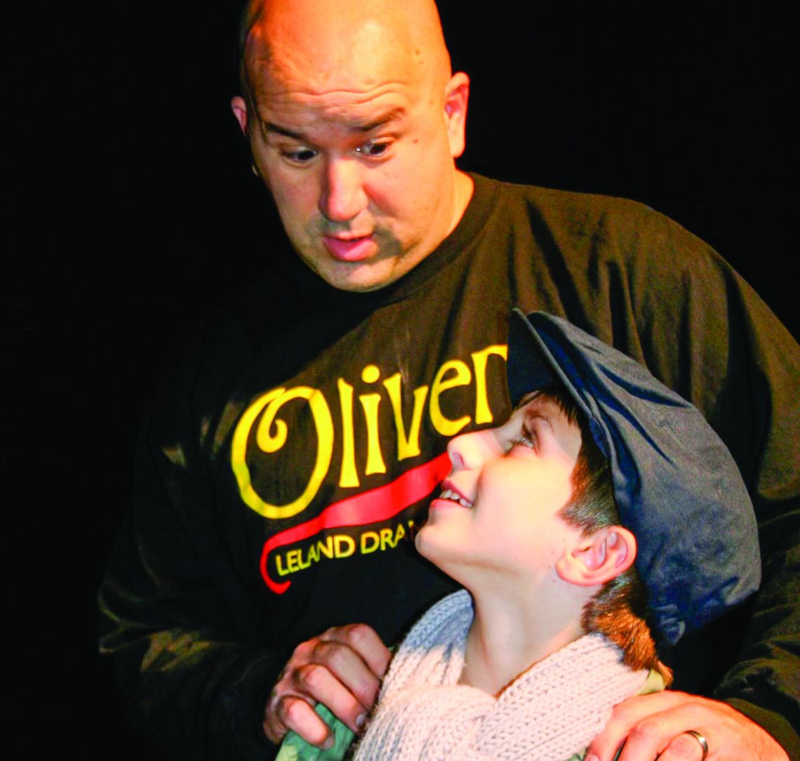 Jeremy Evans is pictured with Lukey Klein during the theater production of “Oliver” at Leland Public School in 2010. Photo courtesy of Jeremy Evans