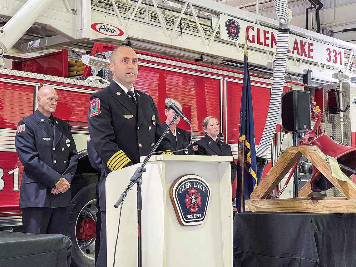 Glen Lake Fire Chief Bryan Ferguson is pictured speaking at their 9/11 commemoration service held last week Wednesday morning at the station. Enterprise photo by Meakalia Previch-Liu
