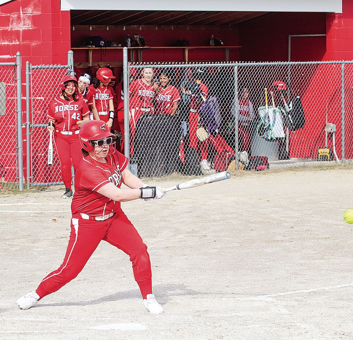Suttons Bay senior Minnie Bardenhagen makes contact during her first softball game against Lake Leelanau St. Mary on Tuesday. Enterprise photo by Brian Freiberger