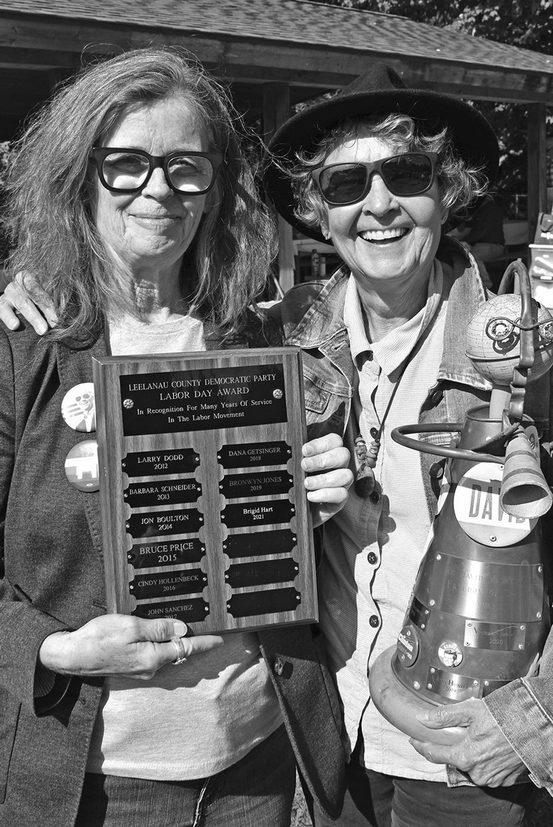 Sam Getsinger, right, accepts a Freedom of Speech Award at the Leelanau Democrats Labor Day 2021 picnic, with party co-chair Brigid Hart. Enterprise file photo