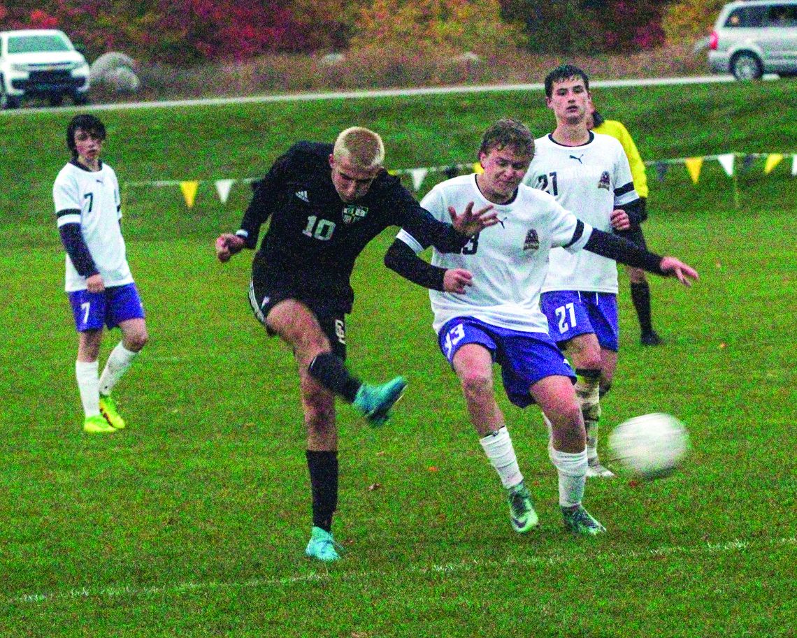 Glen Lake junior Hunter Cox launches a rocket past Pentwater’s goalkeeper to go up 5-4 in extra time and seal the win for the Lakers. Enterprise photo by Brian Freiberger