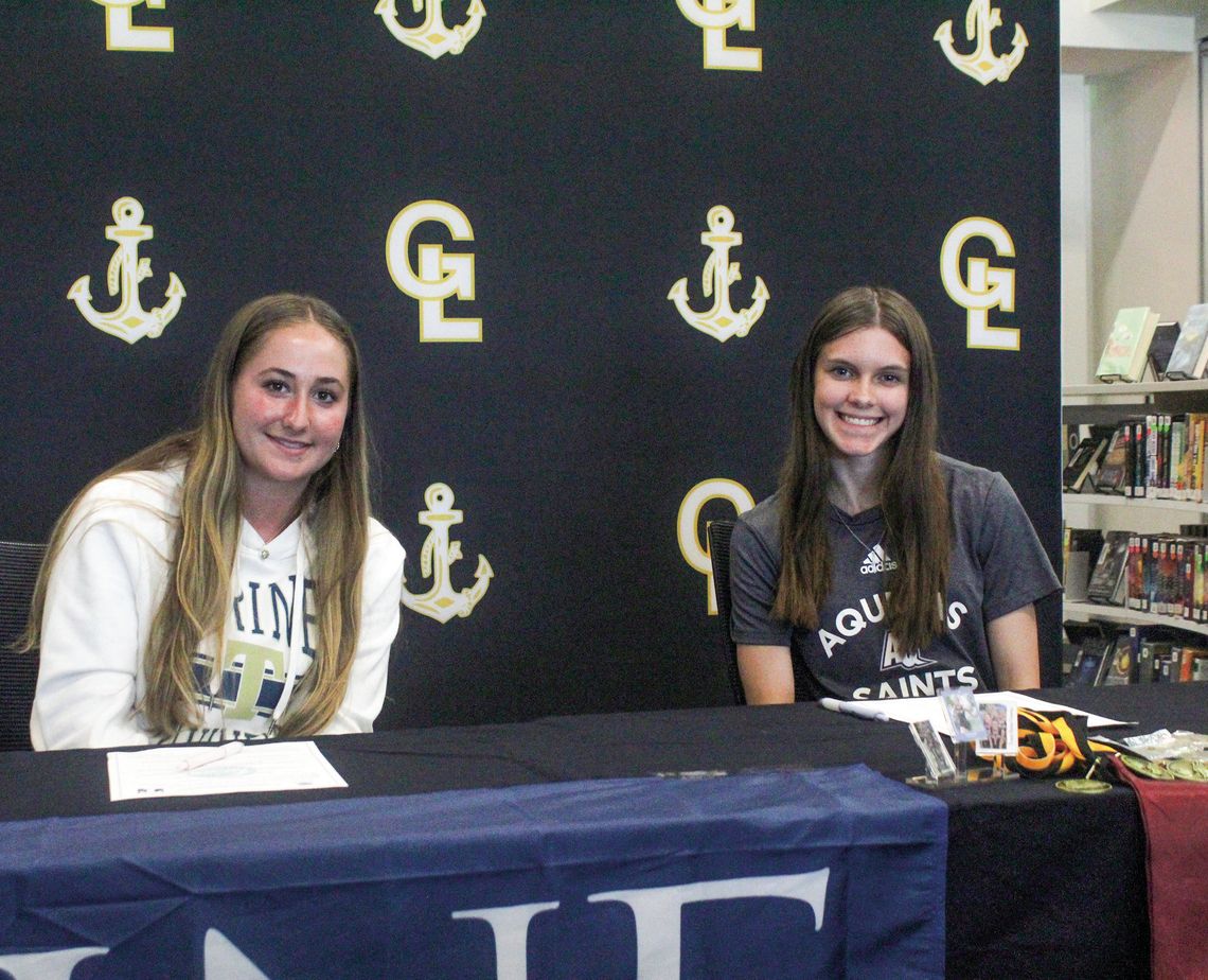 Glen Lake seniors Kariesue Taghon and Paige Steffke signed their letterof- intent to Aquinas College and Trine University Enterprise photo by Brian Freiberger
