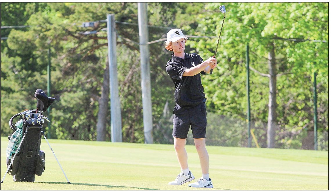 Glen Lake freshman Joel Martin finds himself out of the rough and onto the green during a nine hole Northwest Conference match at the Leland Country Club on Tuesday. Martin finished third on the team with a new highscore of 43. Enterprise photo by Brian Freiberger