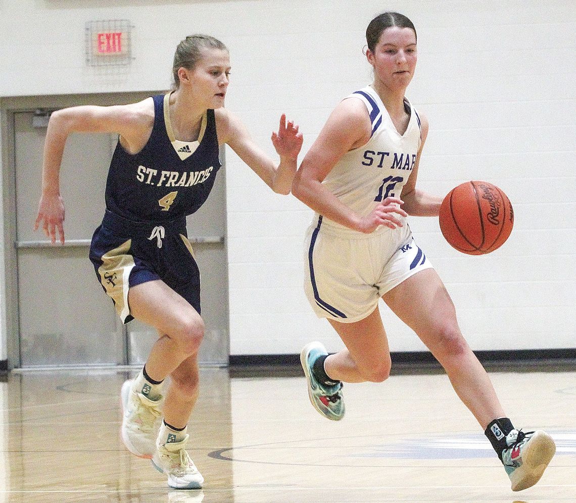 Eagle senior Della Bunek pushes the ball up the court against the Gladiators. St. Mary took care of business for the Eagles first win over the Gladiators since 2007.