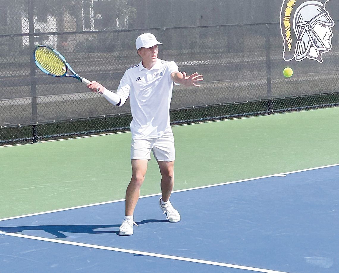 Glen Lake senior Ben Romzak hits a forehand shot against Zeeland West on Saturday during a tournament at TC Central. Courtesy photo