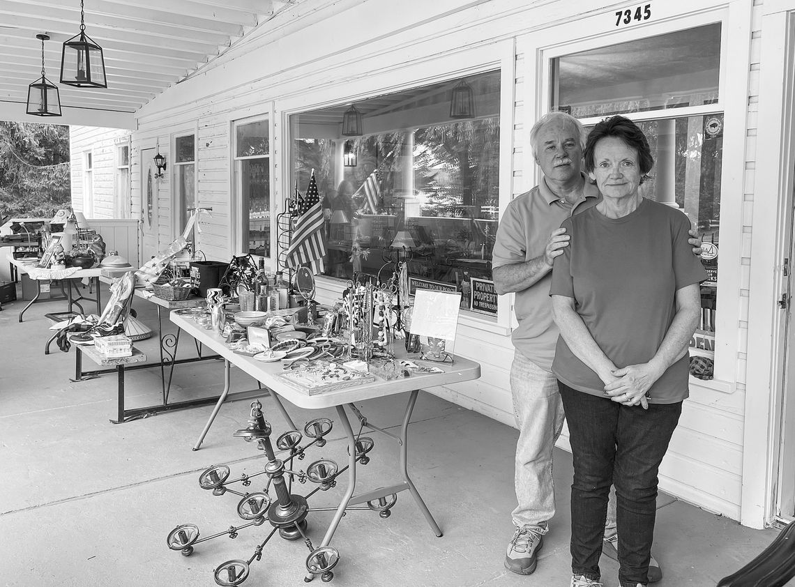 Glen Lake Manor Owner Susan Rife is pictured next to her husband, Rob, on August 30, the first day of their pre-renovation “sale on the porch” . Enterprise photo by Meakalia Previch-Liu