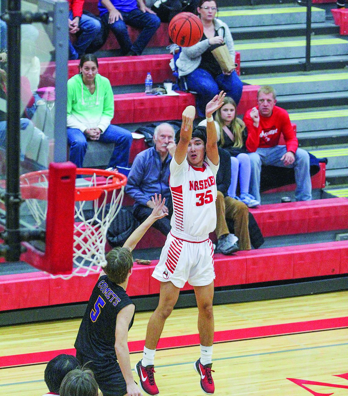 Suttons Bay guard Urijah TwoCrow attempts a 3-pointer against Leland in a 75-54 win Friday. Enterprise photo by Brian Freiberger