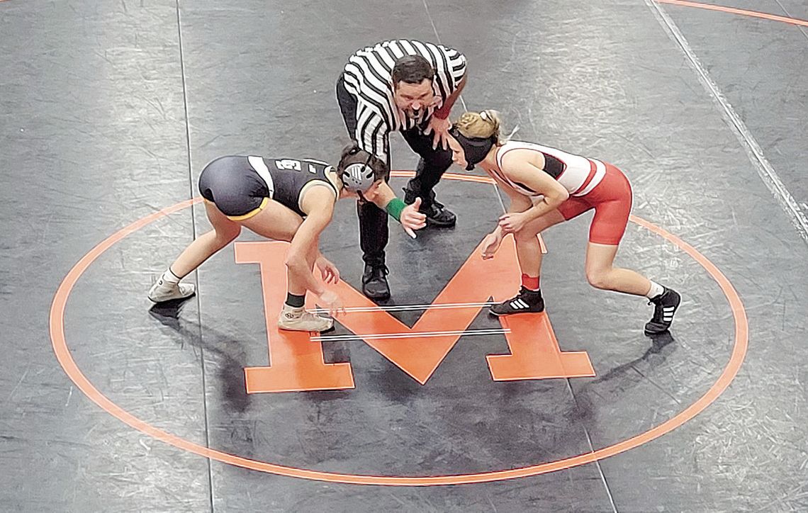 Glen Lake junior Emily Alaimo, left, takes the mat for the first wrestling match in 22 years for the Lakers. Courtesy photo