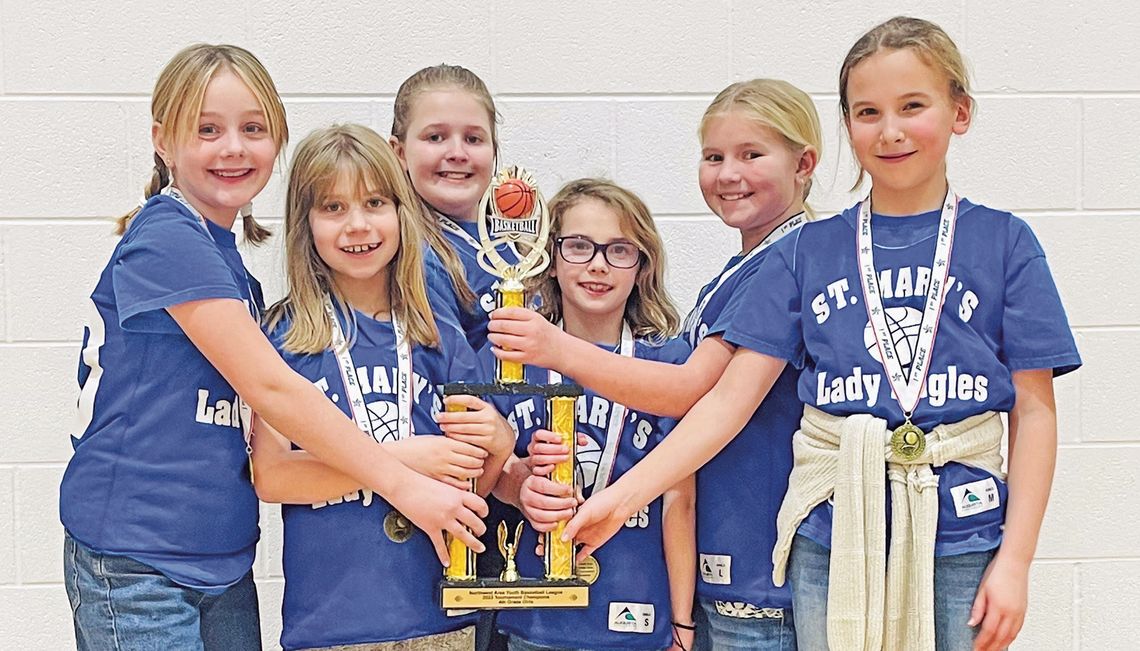 Lake Leelanau St. Mary elementary students Meadow Beman, Eisley West, Adeline Morio, Eliza Plamondon, Mary Grant, Ariana Denoyer with tournament trophy after a successful winter basketball season. Courtesy photo