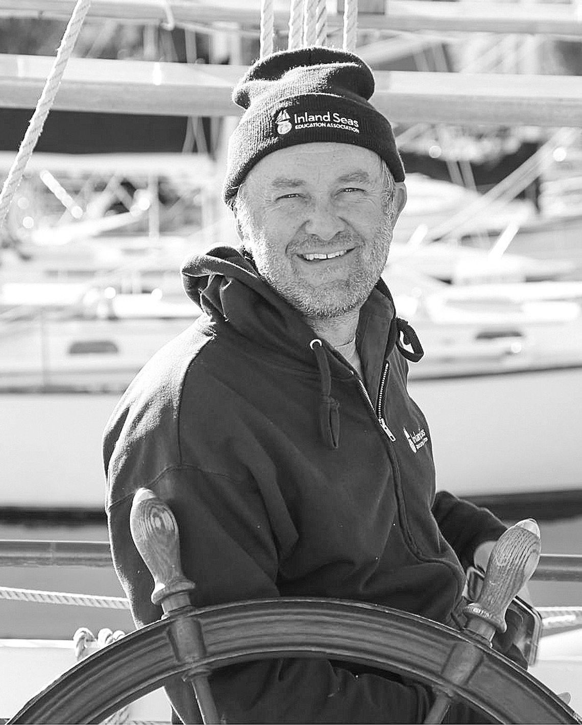Ben Hale, captain of the Inland Seas Education Association schooner bearing the organization’s name, stands on the deck of his tall ship. Hale was recently honored as “sail trainer of the year” 2023 by Tall Ships America. Courtesy photo