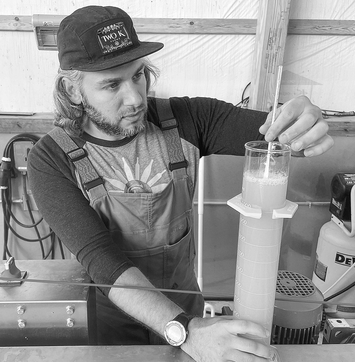 Two K Farms winemaker Kurt Barry measures the brixs levels in freshly pressed apples earlier this week. Enterprise photo by Brian Freiberger