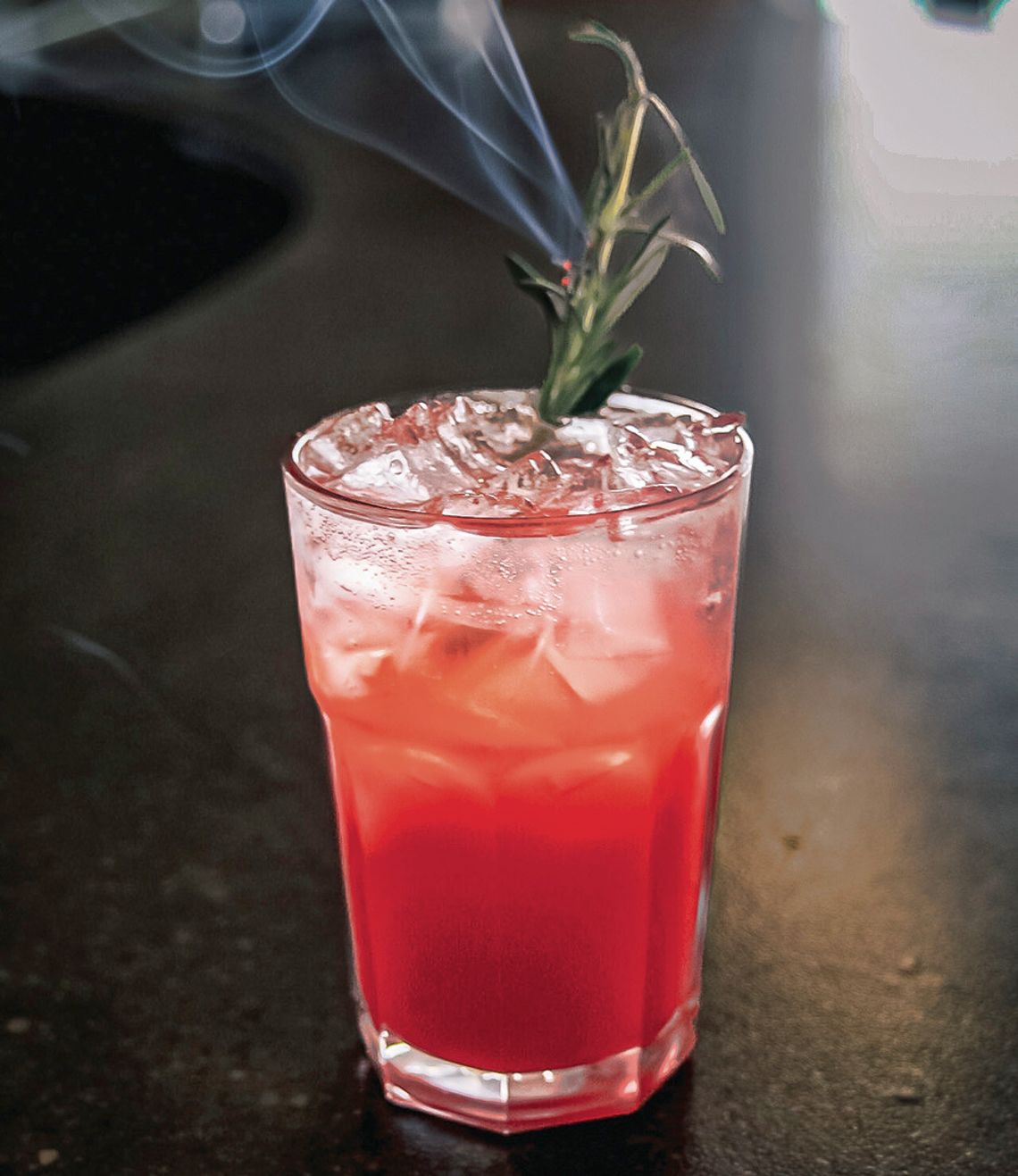 The “nourishing mind” cocktail, one of three zero-proof drinks featured on the menu of the first Hive Social Club event in March, is made of Audacia’s floral berry elixir and paired with Hive housemade raspberry syrup and Alchemy &amp; Co’s nourish herbal tea, garnished with a smoking spri...